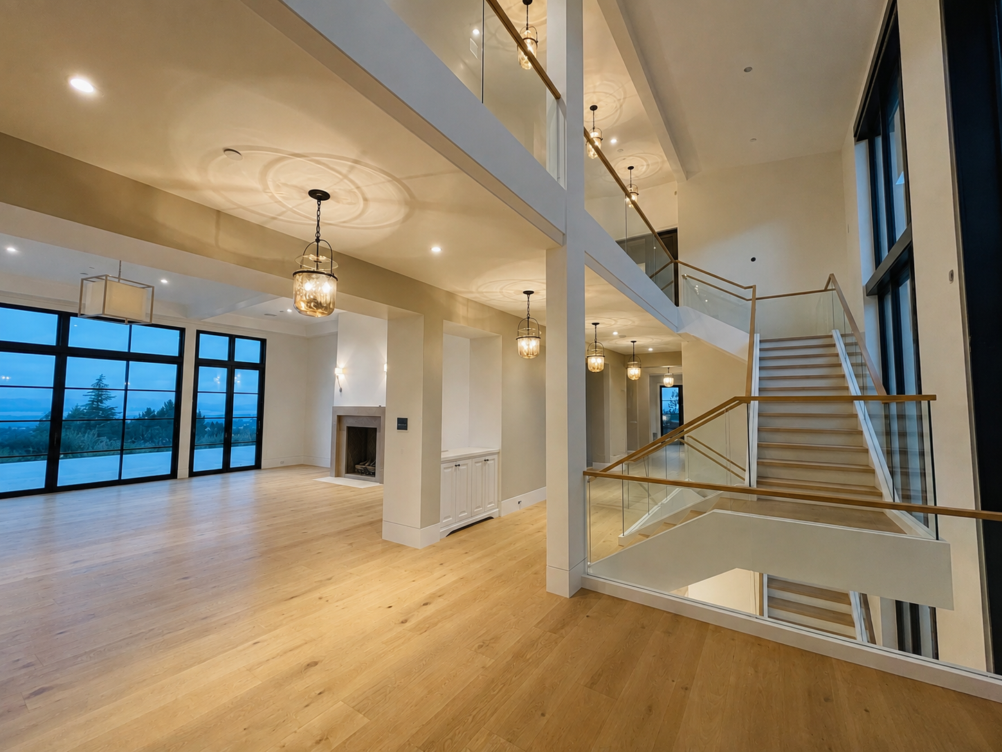 Glass staircase railing in a bright custom home interior