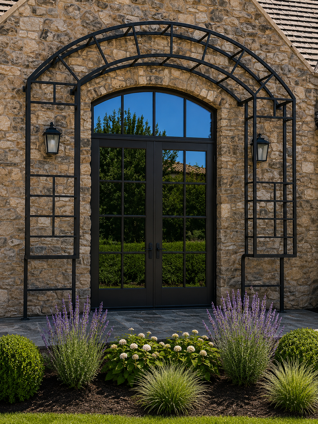 Black arched metal trellis framing exterior double doors