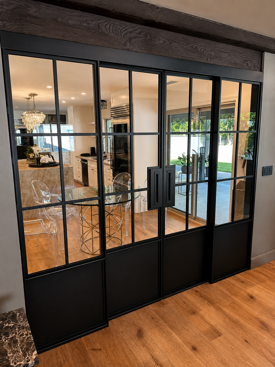Angled view of black interior glass metal doors