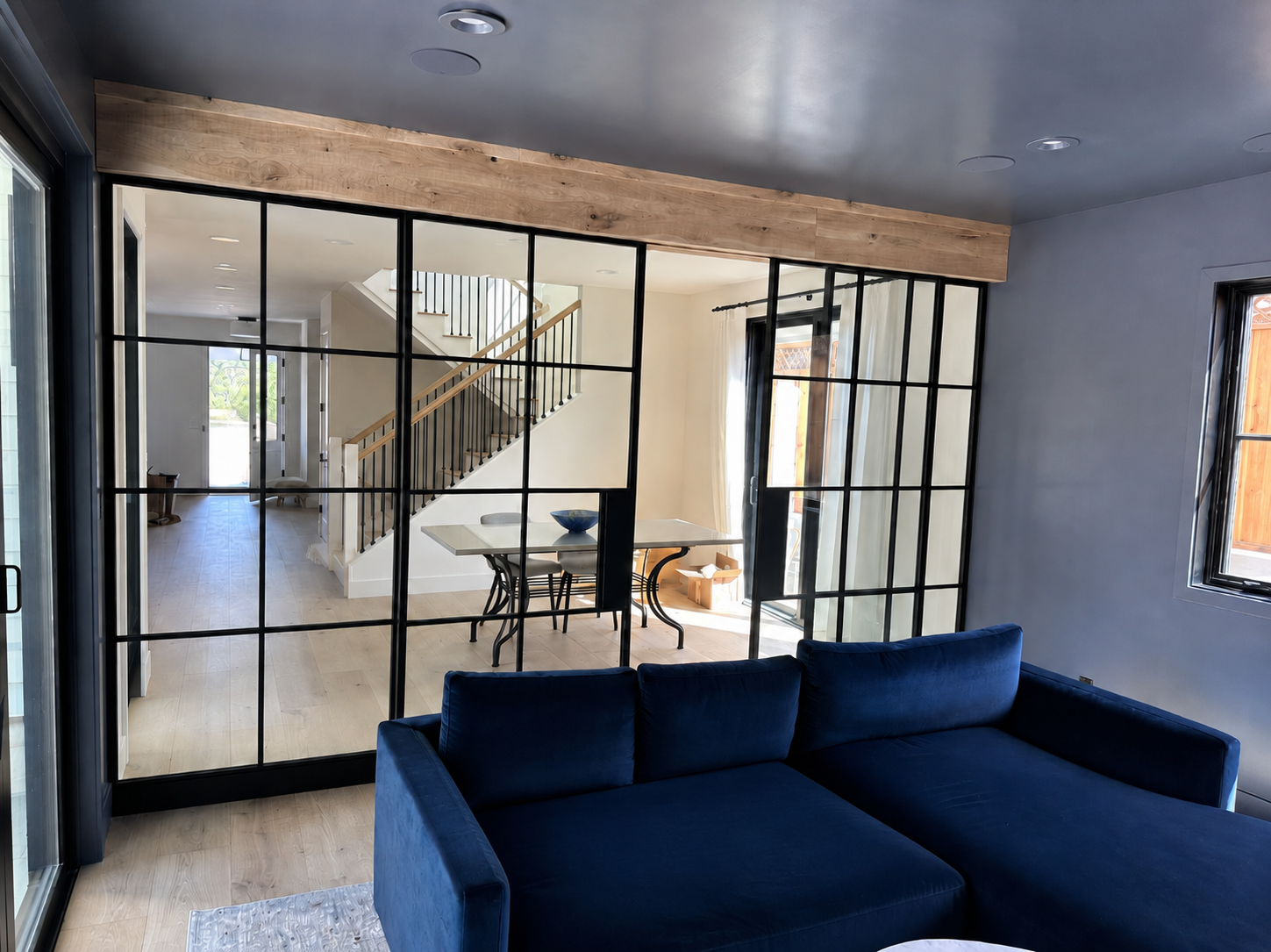 Black metal and glass interior partition doors viewed from lounge