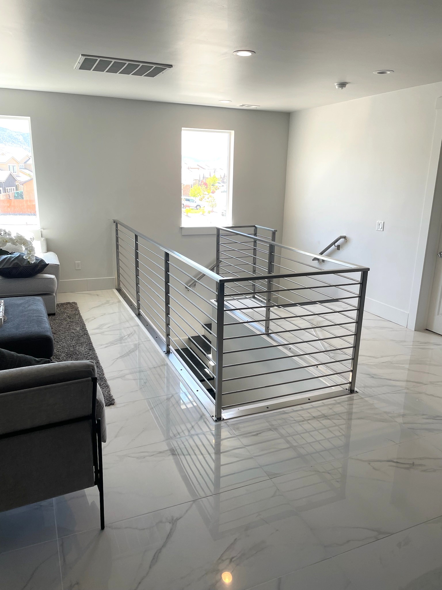 Stainless steel railing around upper floor opening
