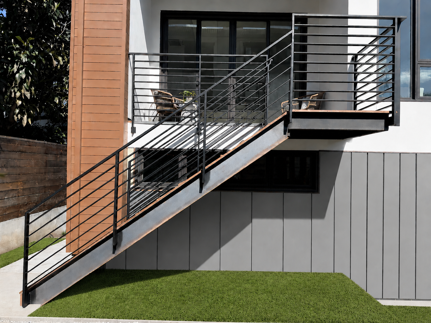 Black exterior railing and stair on modern home
