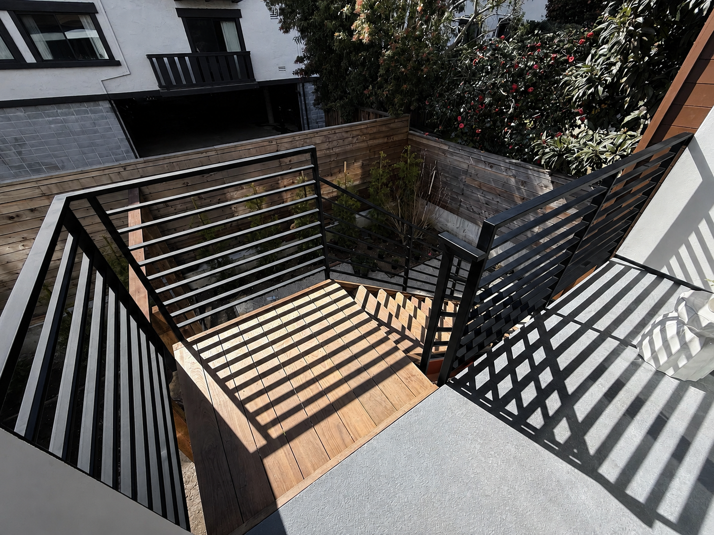 Upper deck railing with black horizontal bars