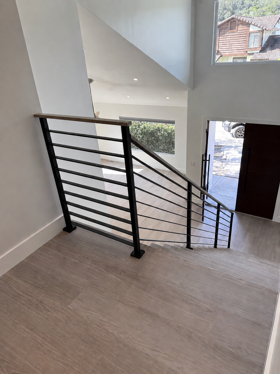 Interior stair railing viewed from upper landing