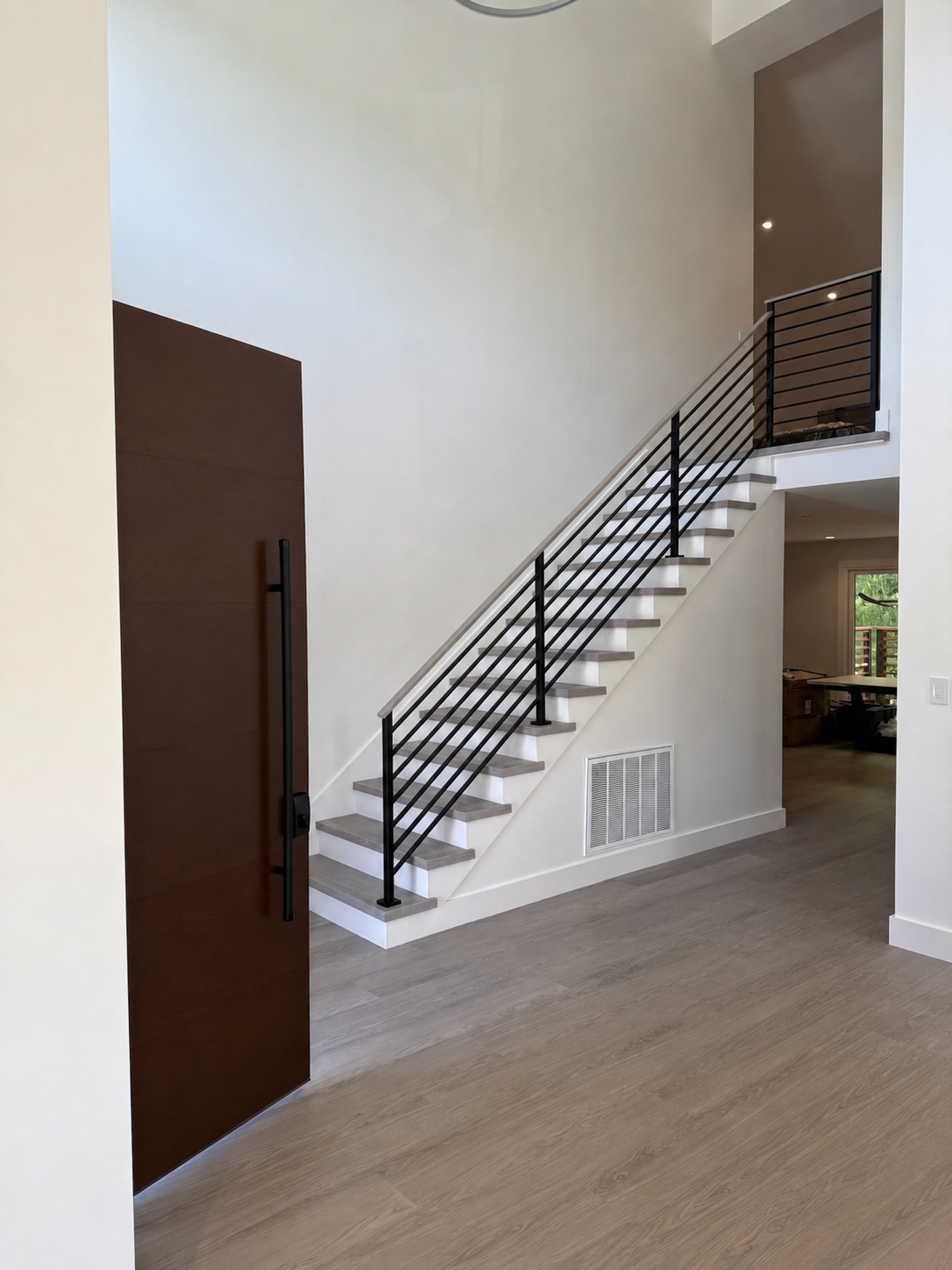Modern interior railing and stair with black horizontal bars