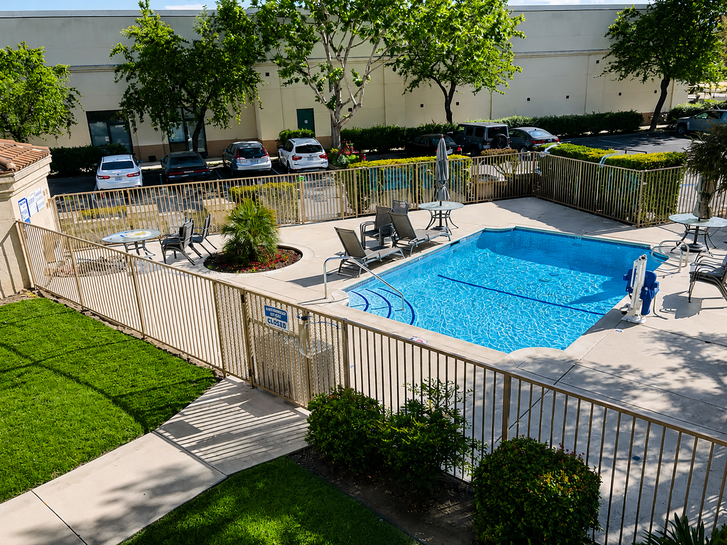 Hotel pool area with beige perimeter railing