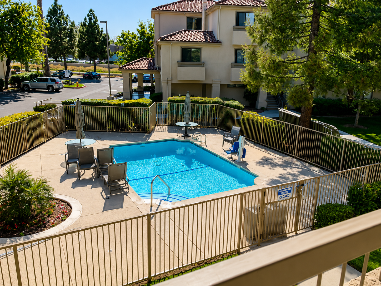Hotel pool railing overview with beige metal guardrail