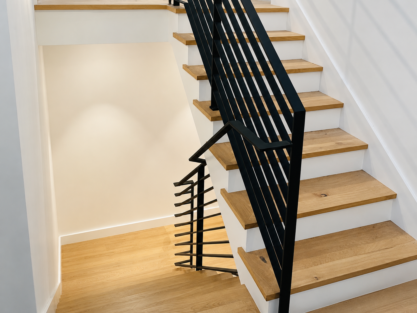 Black stair railing viewed from upper staircase
