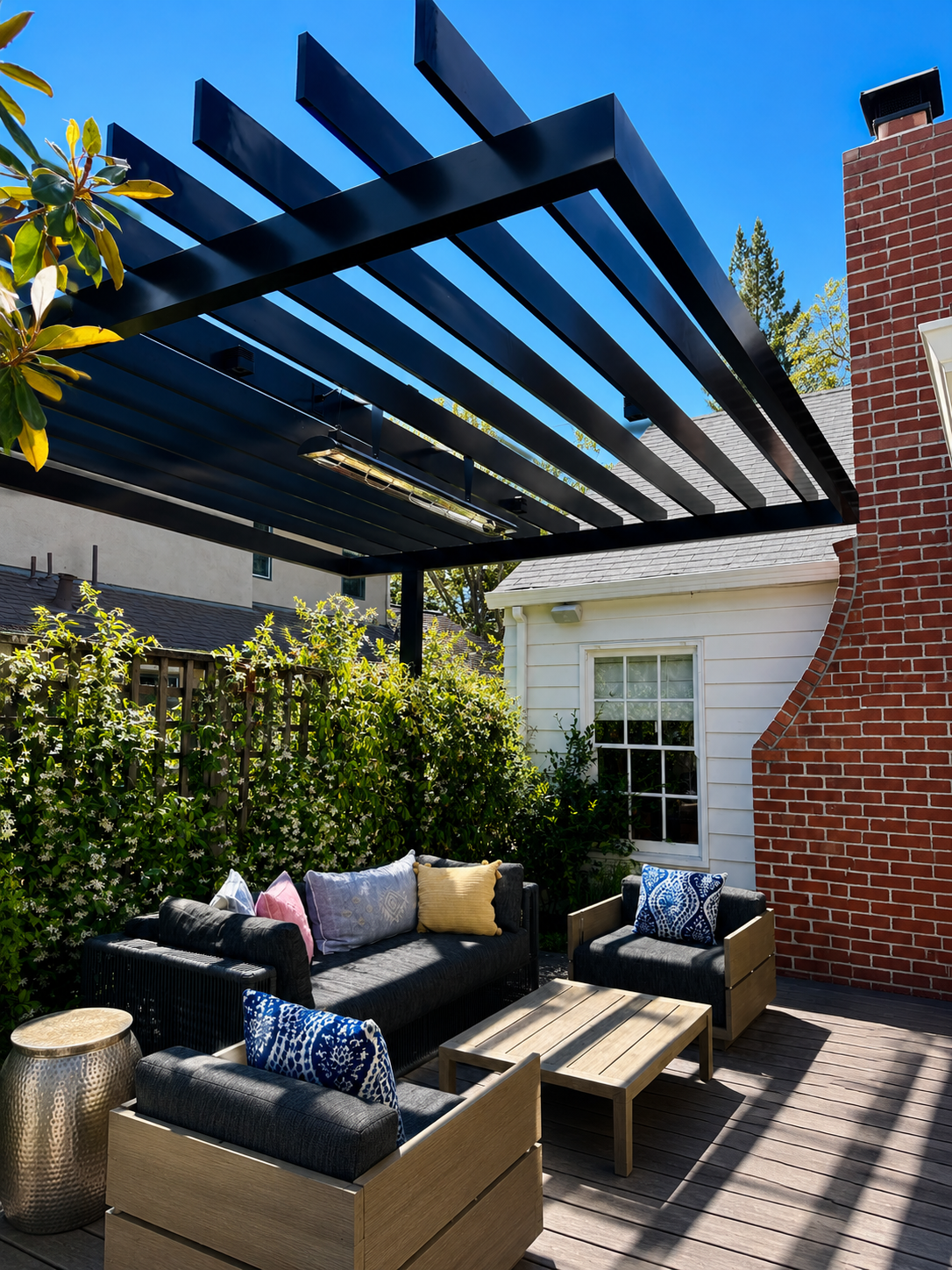 Close view of black metal trellis over patio seating