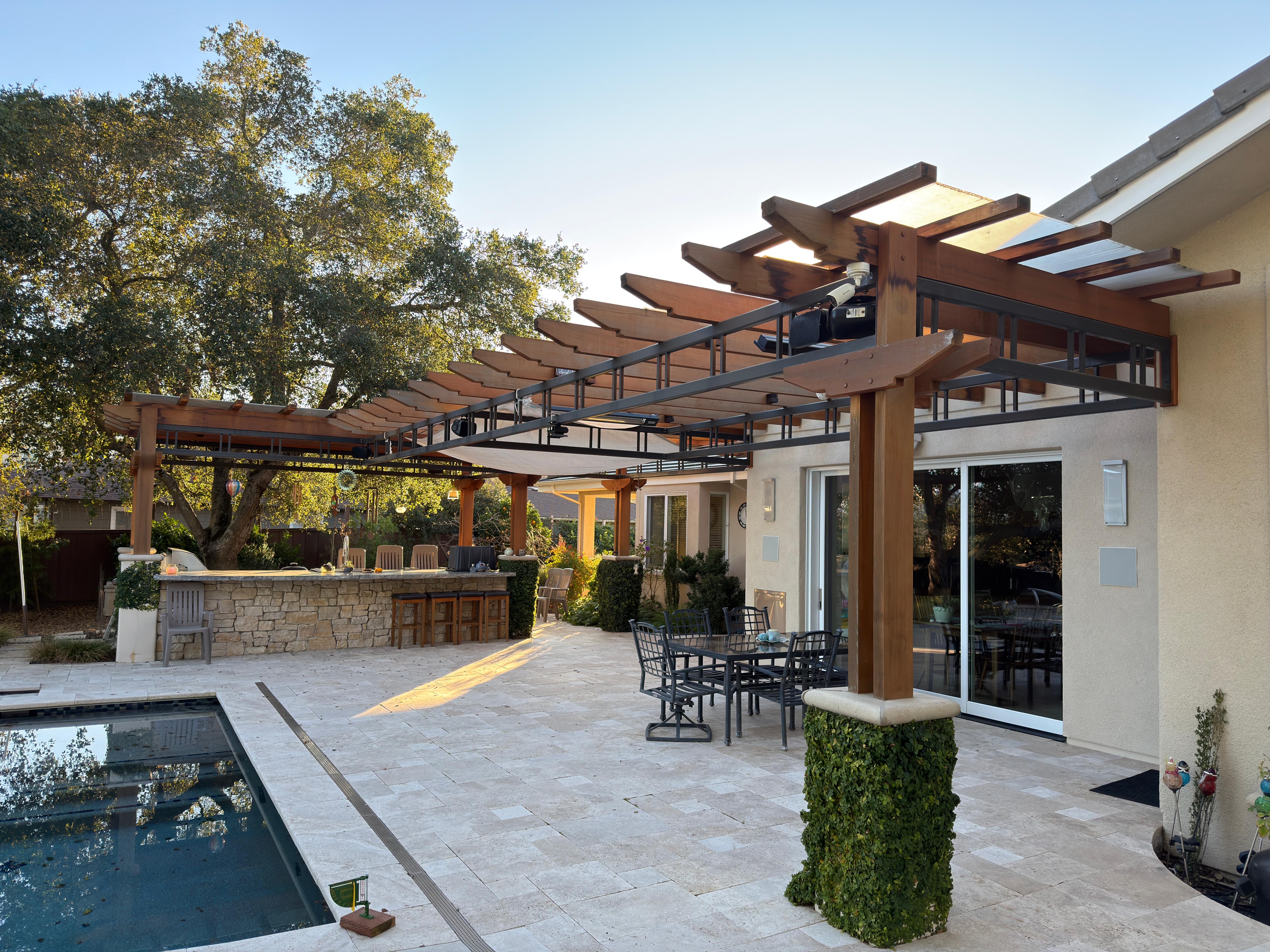 Wood trellis over poolside patio