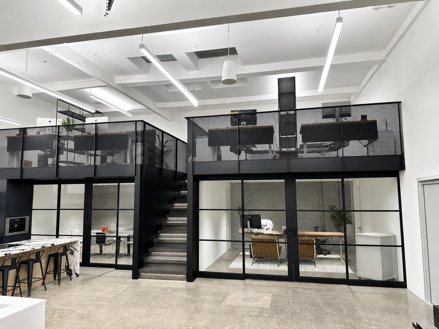 Black metal mezzanine office structure with glass doors
